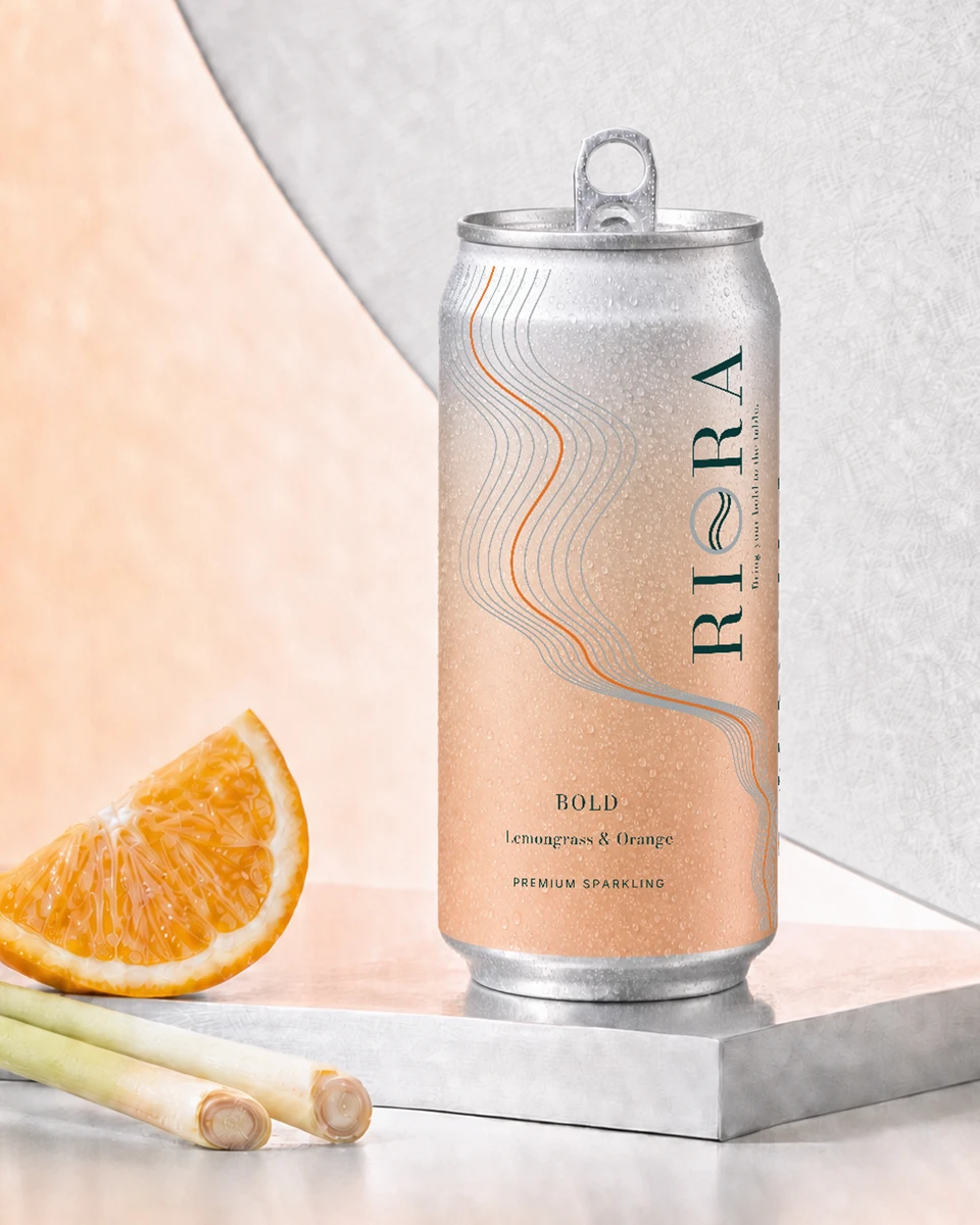 Bold sparkling aluminium can styled with lemongrass & orange